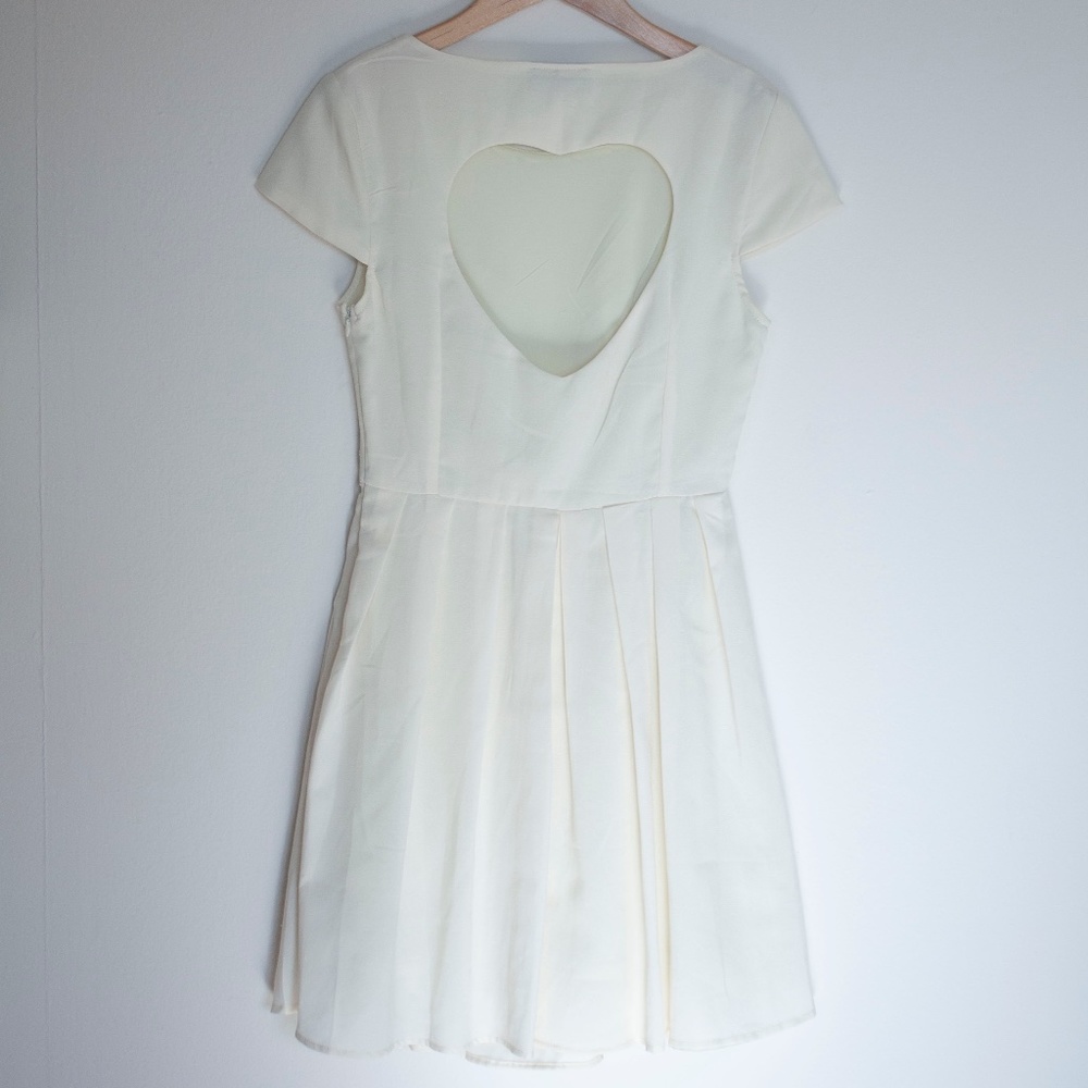 Maude cream dress with cute heart-shaped back cutout